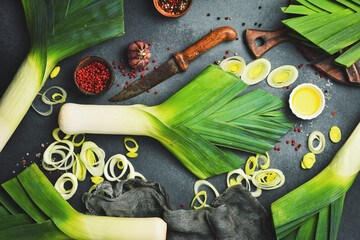 Wall Mural - Preparation for cooking Leek onion Stalks. Leek onion cut into slices. Top view.