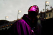 © Connect Images - Silhouette of a young black man gazing upward with a purple light illuminating their face against an evening sky, Berlin, Germany