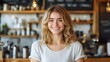 © BlackBird Studio - Cheerful Young Woman in Cozy Café Setting with Warm Atmosphere