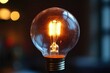 © Gatherina - Bright light bulb shining in the dark, creating warm atmosphere
