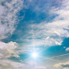 Wall Mural - beautiful cirrus clouds and sun against the blue sky.