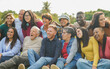 © Sabrina - Crowd of happy multiracial people hugging each other outdoor while smiling in front of camera - Multi generational community and diversity concept