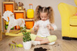 © Pixel-Shot - Little girl playing with plant soil at home