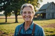 © ThomasLENNE - Close portrait of a smiling senior American female farmer standing and looking at the camera, outdoors American rural blurred background