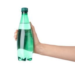 Woman holding plastic bottle of water on white background, closeup