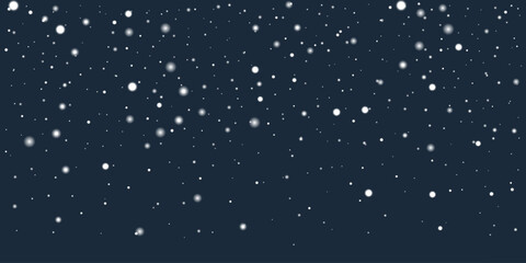 Wall Mural - light snowflakes falling gently against a dark blue background, creating winter atmosphere. white sn