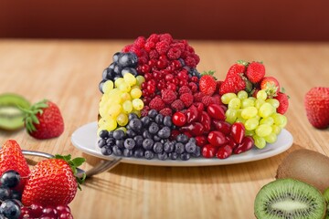 Poster - bowl of fresh tasty fruit salad on a wooden table.