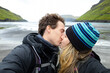 © ADDICTIVE STOCK - Traveler Couple Sharing a Kiss at Tjørnuvik Beach, Faroe Islands