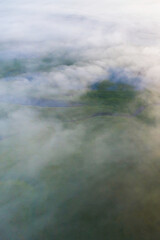 Wall Mural - clouds over water