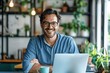 © zhuan - Confident Young Businessman Enjoying Coffee While Working on Laptop at Office or Home