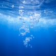 © Olive - Bubbles and seething water in the light of sunlight.Blue water texture.