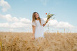 © sharshonm - Happy girl in a white dress in the field. Sunny day.