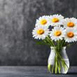 © suwatthana - White daisies in a vase on a dark grey background, chamomile, white flowers, yellow center, glass vase, floral