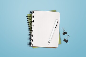 Canvas Print - Top view of blank notebook and pen on background