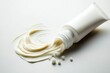 © thewarit - A white cream tube is placed on a white background.
