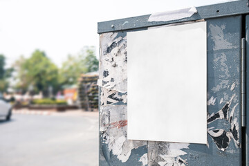 Wall Mural - Mockup white paper or white sticker poster displayed on a sidewalk wall. Promotion information for marketing announcements and details with clipping path.