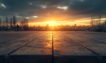 Aufkleber - A serene sunset viewed over textured ground, with silhouetted trees in the background, creating a picturesque and tranquil atmosphere.