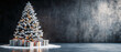 © ELmidoi-AI - Christmas tree sprayed with snow standing with gift boxes, black concrete textured wall in background for copy space, luxury feeling for seasonal greetings.