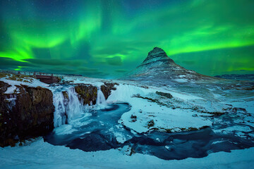 Wall Mural - aurora borealis or northern lights over kirkjufell mountain in iceland