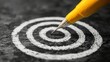 © admin_design - Pencil erasing target on black surface, symbol of goal achievement, new beginnings and strategic shifts
