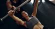 © peopleimages.com - Exercise, help or weightlifting with personal trainer and woman in gym for strength training from above. Barbell, fitness or workout with coach and confident person in health club for challenge