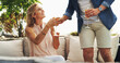 © peopleimages.com - Happy woman, man and drinks on sofa for vacation, holiday and travel for honeymoon in hotel. Newlyweds, love and mimosa in luxury accommodation for bonding, relationship development or care at resort
