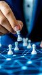 © FTN-STUDIO - A person moves a pawn on a digital chessboard, symbolizing strategy and decision-making in a modern, tech-driven environment.