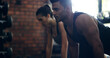 © peopleimages.com - Personal trainer, workout and fitness with man in gym for exercise, challenge and muscle. Wellness, training and sports with woman and coach in health club for athlete, performance and teamwork