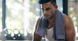 © peopleimages.com - Tired, towel and man with thinking, sweat and gym for wellness, exercise and break as athlete. Male person, recovery and plan for workout, endurance and fitness as challenge, performance and training