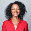 © Robert Kneschke - Confident Botswanan woman smiling brightly in red shirt portrait