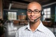 © BillionPhotos.com - Happy call center worker wearing headset working in support office.