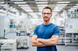 © Westend61 - Portrait of a confident employee in a factory