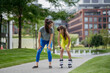 © Westend61 - Mother teaches her daughter to roller skate in the city