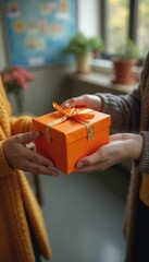 Wall Mural - Two people exchanging an orange gift box in a cozy indoor space filled with plants during autumn