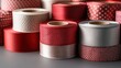 © AFFANYUDA - Assorted red, white, and grey ribbon spools.