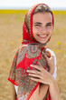© Andrey_Arkusha - Close up portrait of a young woman in a traditional patterned headscarf