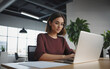 © itakdalee - woman working with a laptop in a modern office, freelancer, businesswoman at work