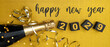 © Corri Seizinger - happy new year, silvester,  new year's eve party celebration greeting card with text - Champagne bottle, ribbons and cubes with year number 2029, on golden glitter table background, top view, flat lay