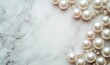 © Александр Михайлюк - Pearls background. Pearls on marble background. Fashion and luxury jewelry concept