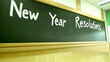 © Stacy - Chalkboard with 'New Year Resolutions' written in chalk, emphasizing goal setting and motivation in a classroom environment