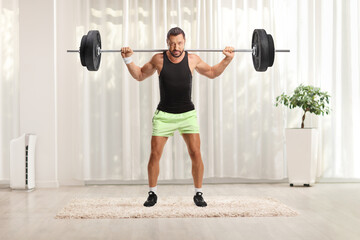 Wall Mural - Man lifting weights in a room