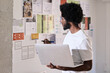 © Guille Faingold/Stocksy - Designer Strategizing Projects. Man with laptop analyzing plans