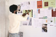 © Guille Faingold/Stocksy - Professional organizing documents on a mood board.