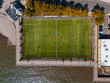 © Yakov Knyazev/Stocksy - Aerial View of Waterfront Soccer Field