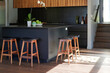 © Rowena Naylor/Stocksy - Modern kitchen interior with island and bar stools in bright sunlight