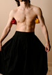© Ulas&Merve/Stocksy - Creative Portrait of Shirtless Man Holding Bell Peppers