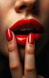 Bright sensual and plump lips painted with bright glaring red lipstick close-up. Women's cosmetics, bright makeup.