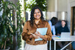 © Pedro Merino/Stocksy - Portrait of an Indian businesswoman in the office