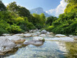 © Lea Csontos/Stocksy - Shallow, crystal clear stream (Rio Cavallo) in the Italian mountains.