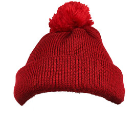 bright red knitted winter beanie with a fluffy pom-pom on top isolated on white background.